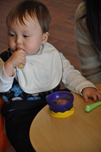 Baby trying a variety of food